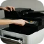 Engineer servicing an office printer